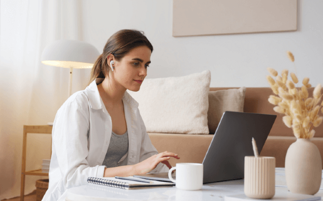 Woman working on laptop in home office