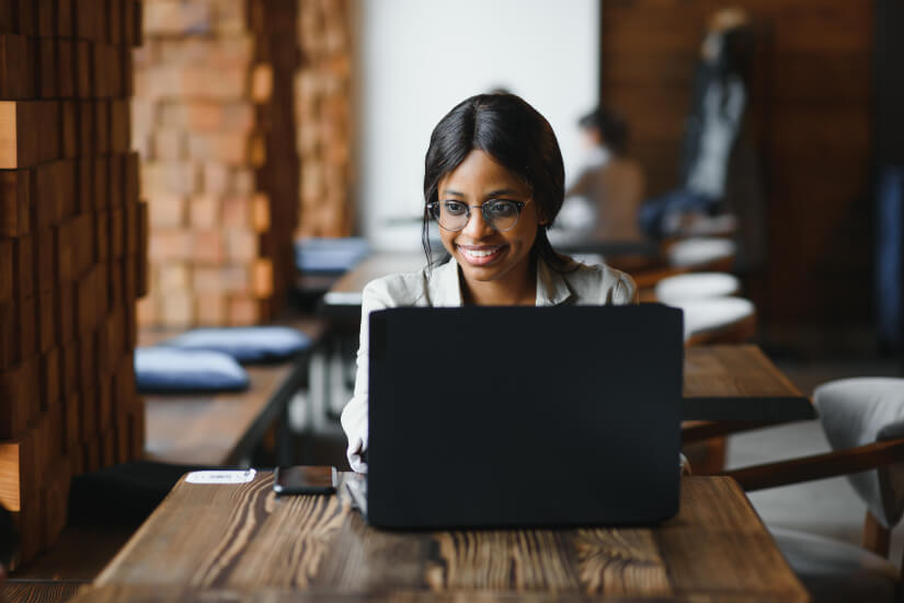 Black woman programmer using laptop