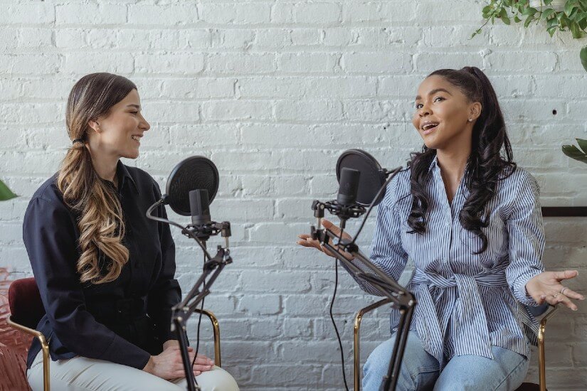 Two woman on a podcast